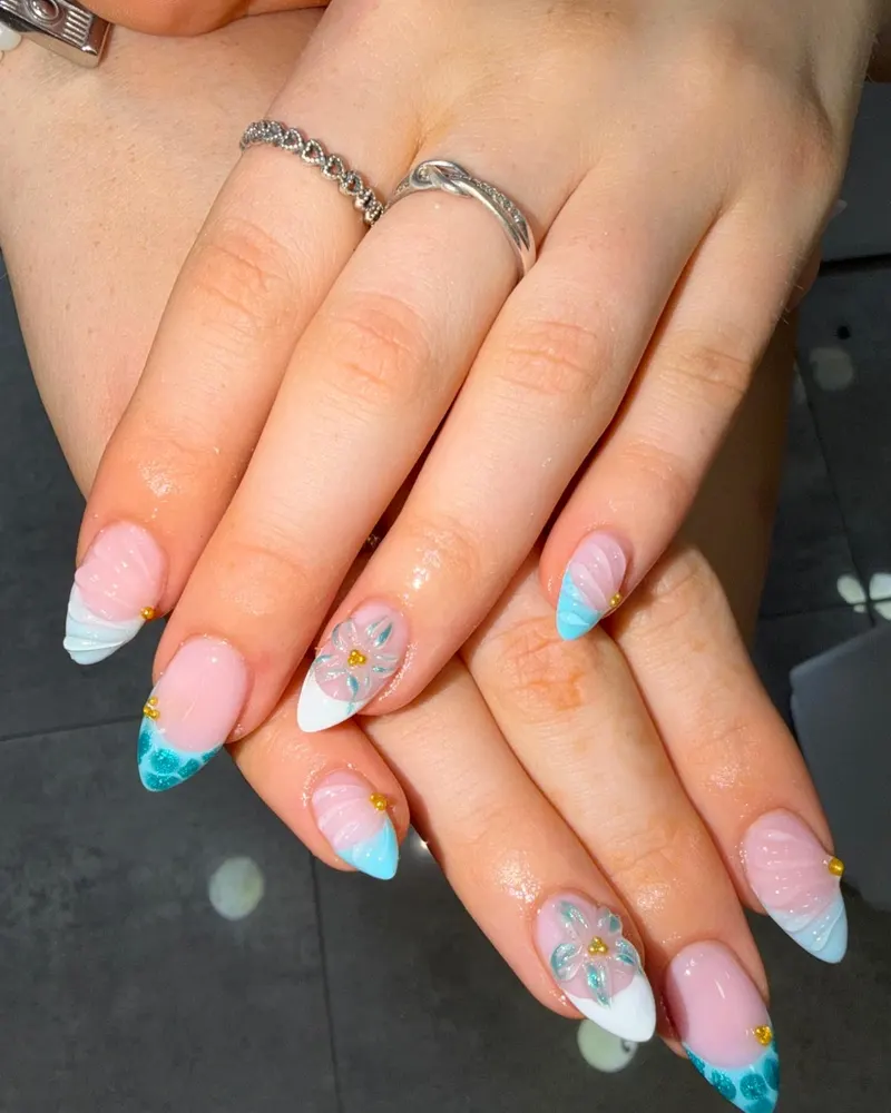 Blue French tips with painted flowers