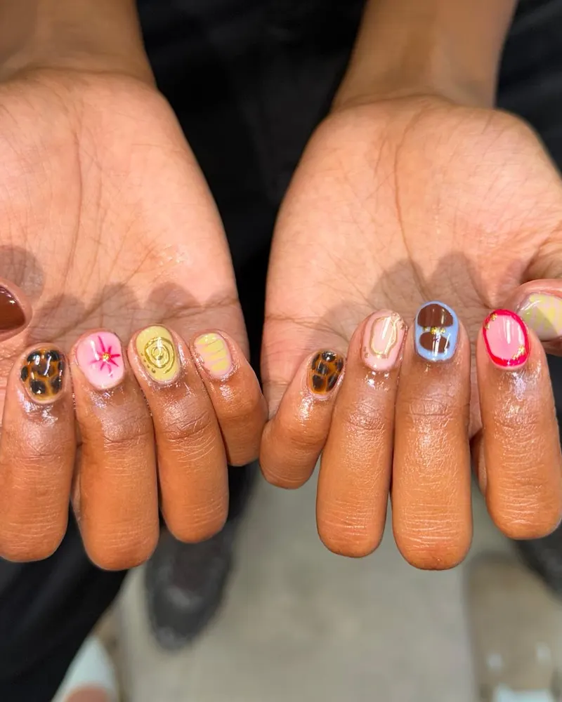Short nails with tiny hand-painted icons
